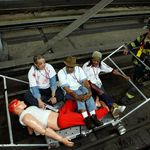 During the emergency response drill, firefighters take "victims" of the simulated explosion away by aluminum rail cars.